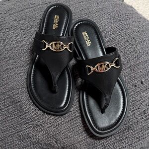 Michael Kors brand new Black Thong Sandals with Gold MK Accent